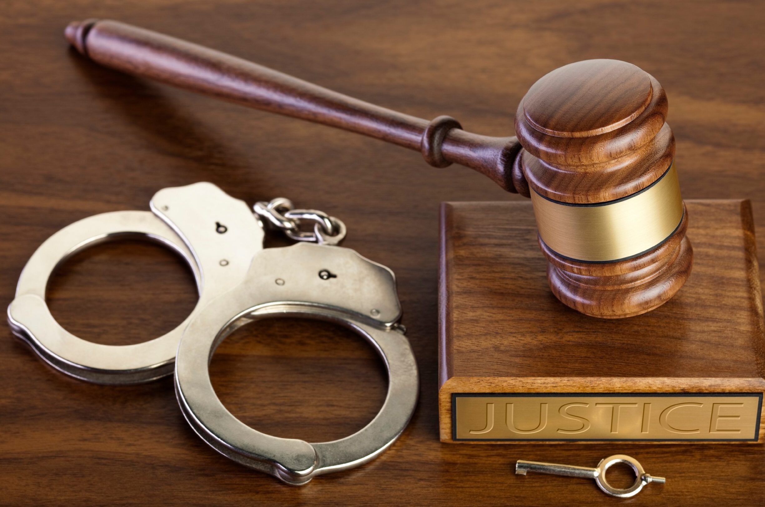 handcuffs and gavel symbolizing serious crimes and justice