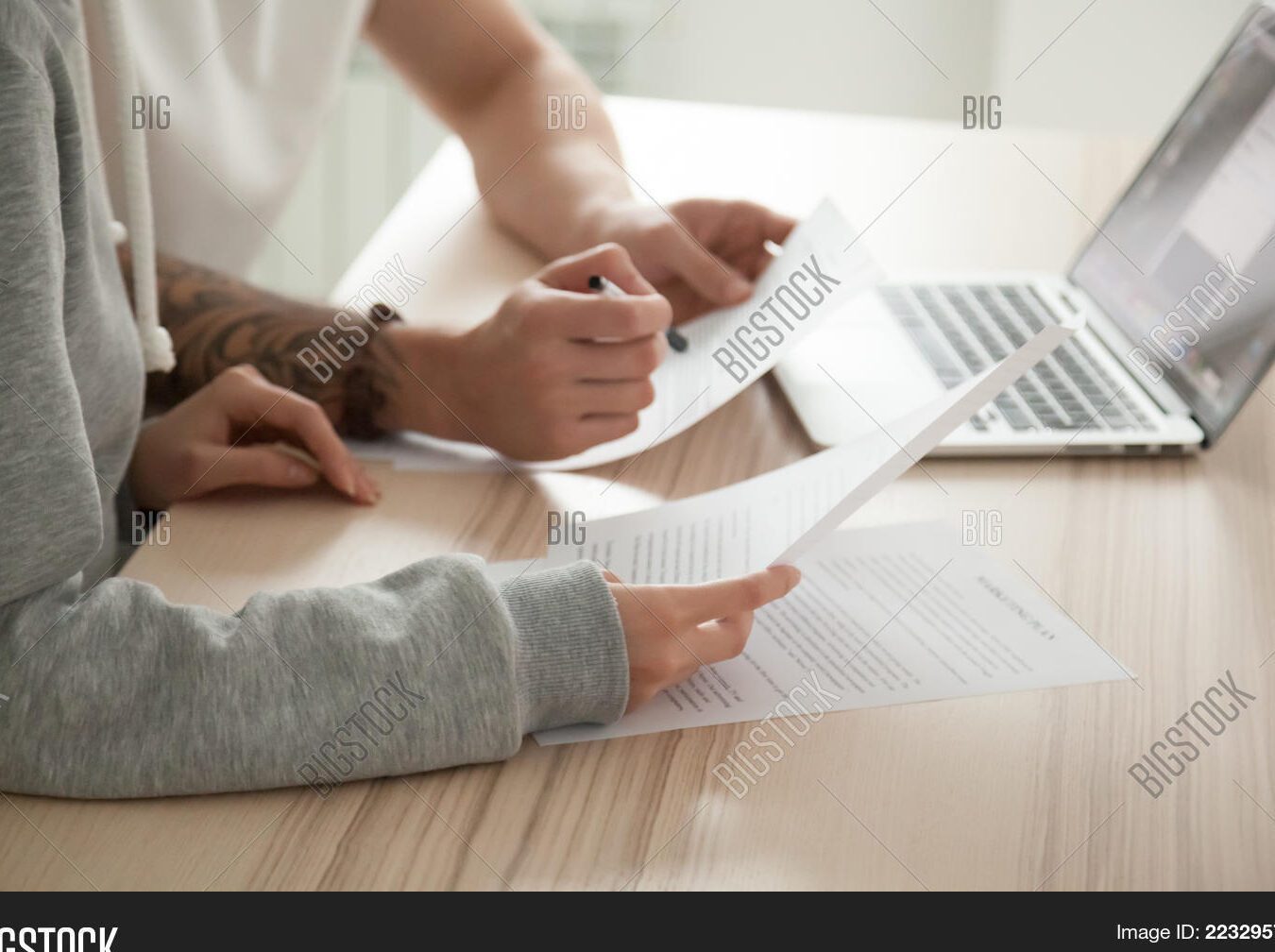 image couples holding hands with legal documents