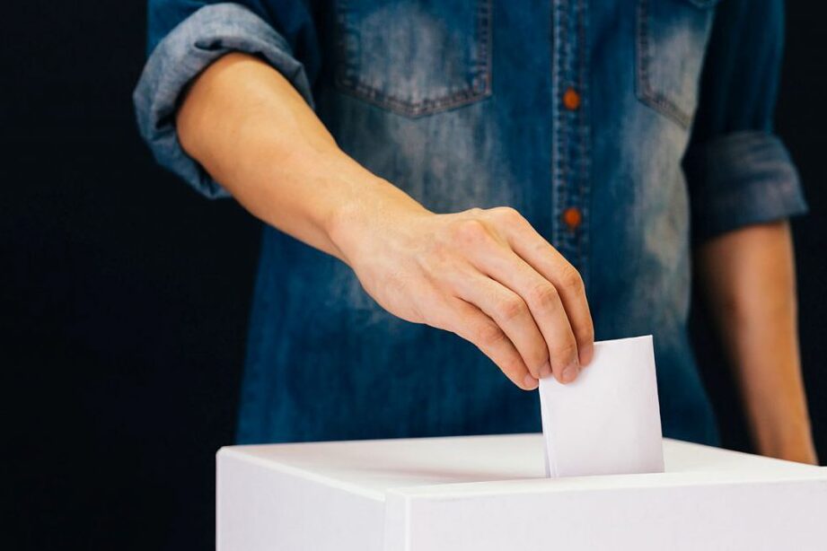 person filling out a ballot for union elections