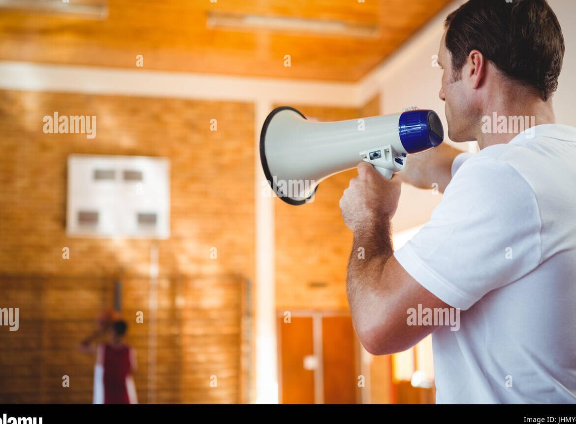 person holding a megaphone in front of a judge