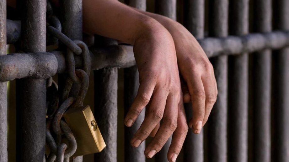 prison bars symbolizing the justice systems detention