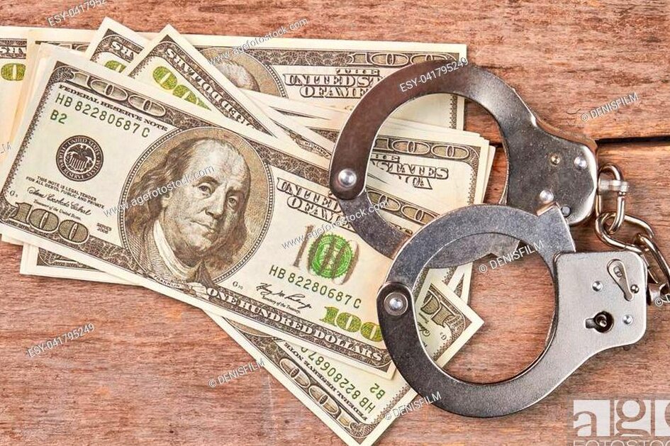 stacks of cash and handcuffs
