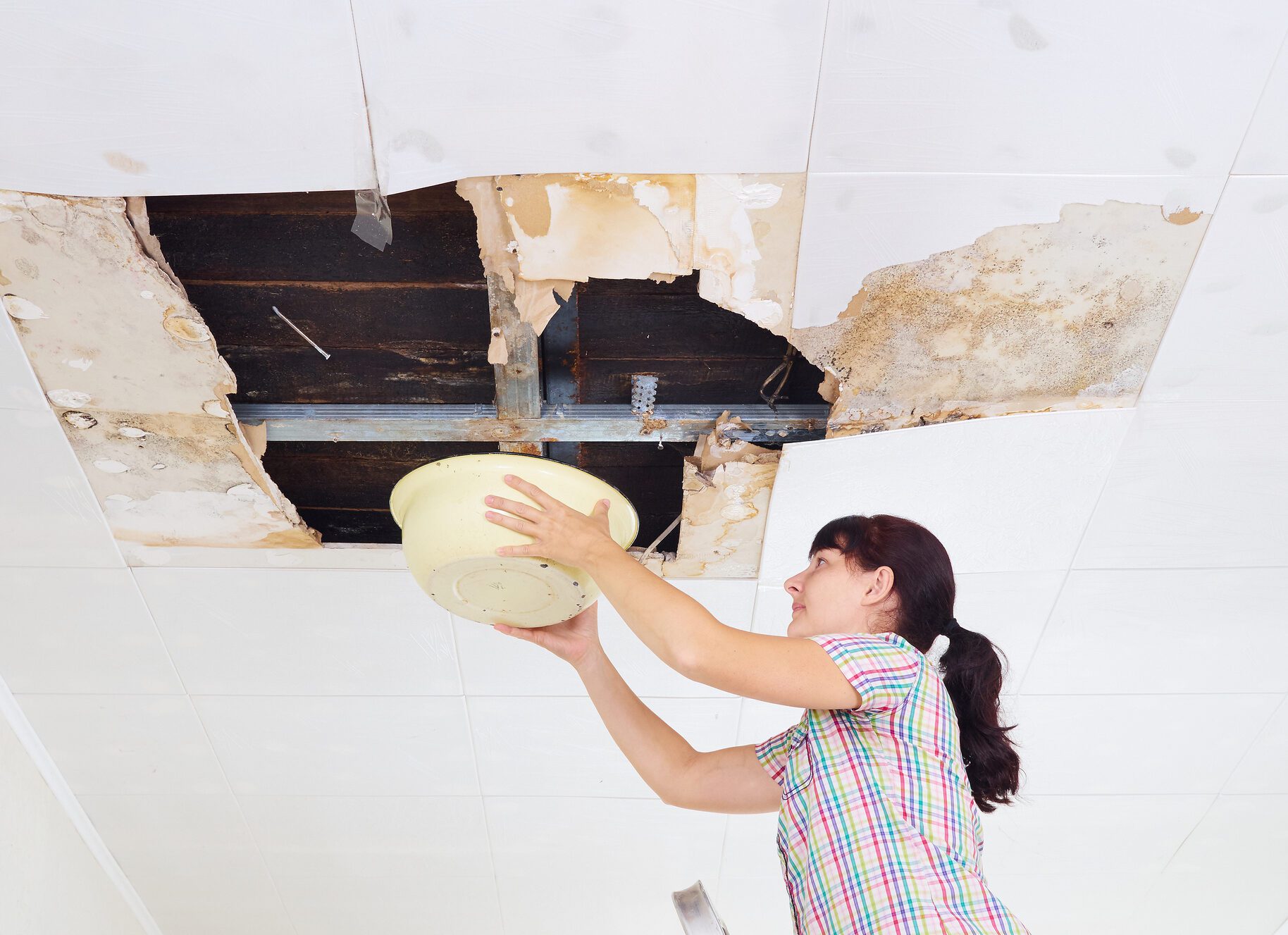 water leaking from ceiling in apartment building